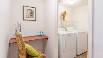 Desert Sands laundry room with standard washer and dryer. 